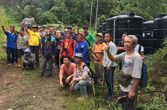 Satisfaction on the faces of some of those involved after the project was completed last December.