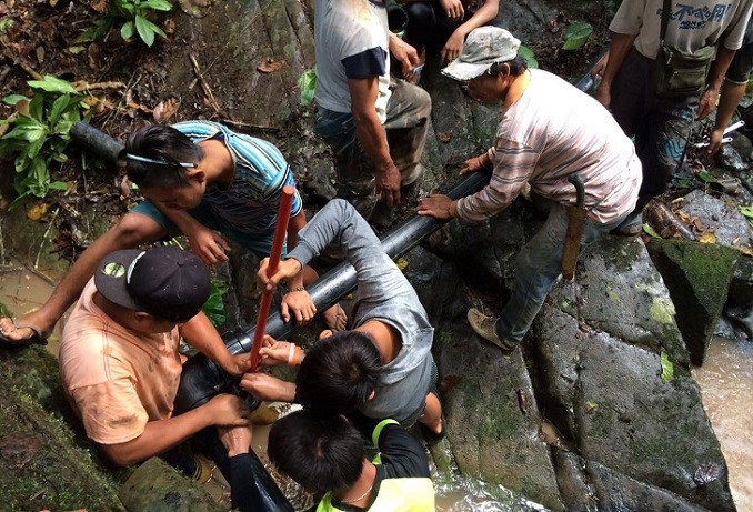 Villagers and volunteers put skills and expertise together to ensure clean water reaches their houses.